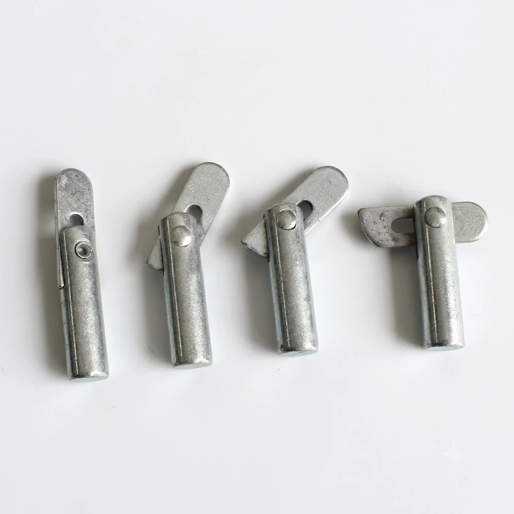 Industrial grade steel brace pin with a gravity-activated drop head welded onto a scaffolding vertical frame to lock a diagonal cross brace securely.