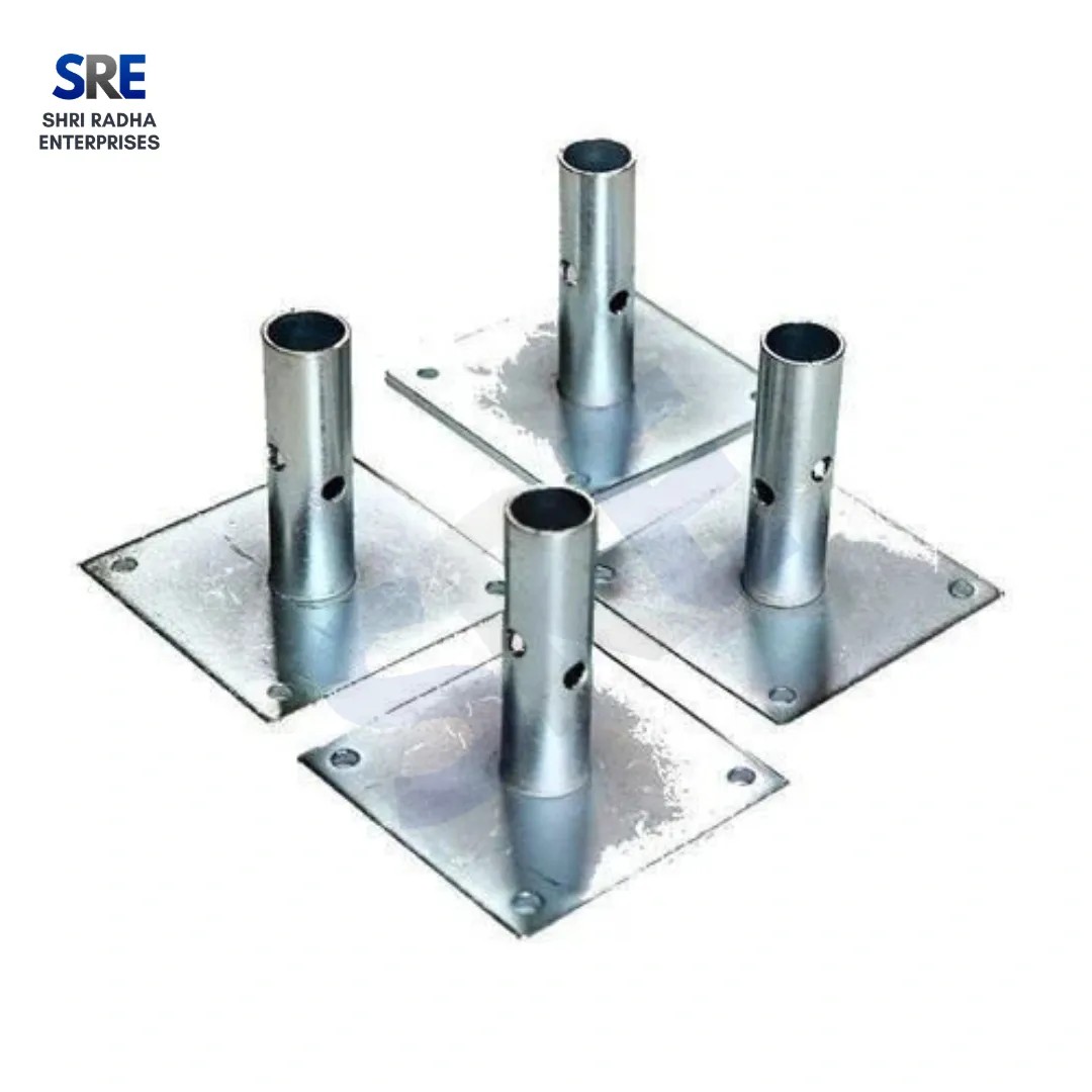 Set of four galvanized steel Base Plates with welded spigots for industrial construction scaffolding.