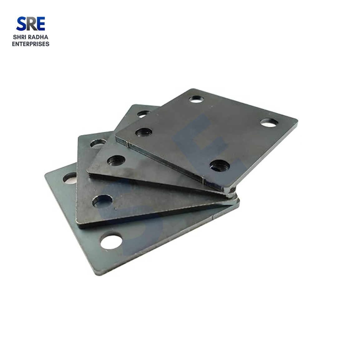 Heavy-duty square steel scaffolding base plates stacked together, featuring precision-drilled corner holes for secure construction anchoring by Shri Radha Enterprises.